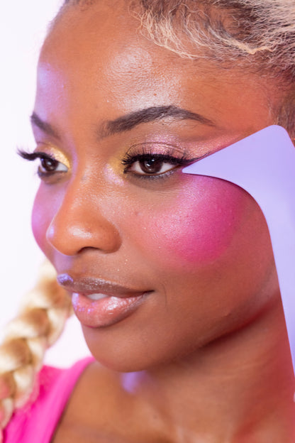 Model using the makeup helper tool to apply a creative beauty makeup application using the Ono makeup tool